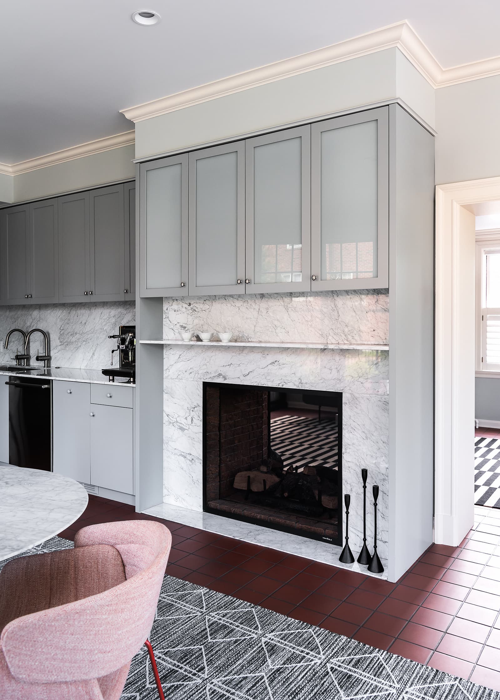 Architecture by Patterhn Ives.  Photography by Karen A Palmer.  Fireplace with television hidden behind folding cabinet doors.