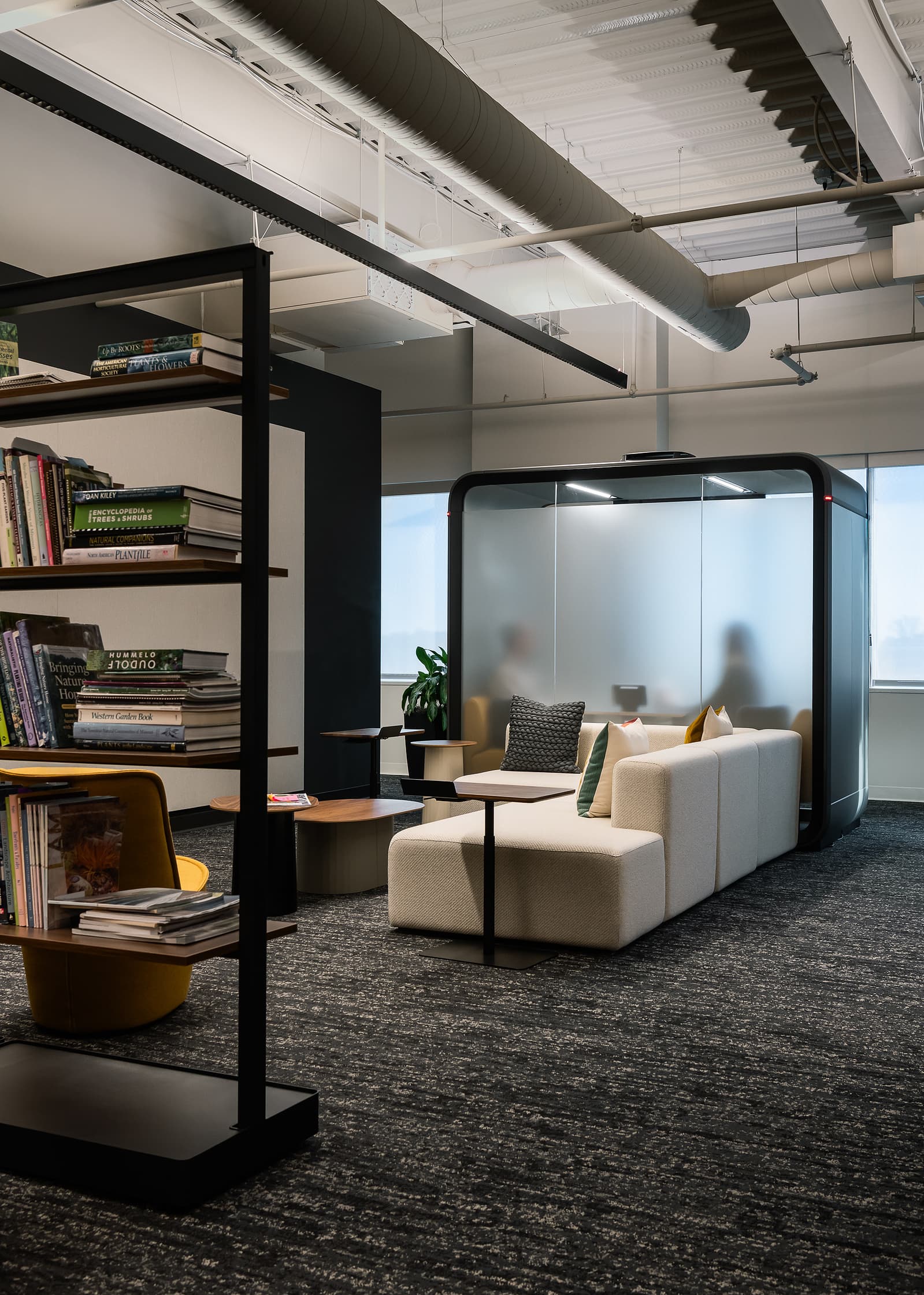 Image showcasing a Framery pod with frosted glass for privacy.