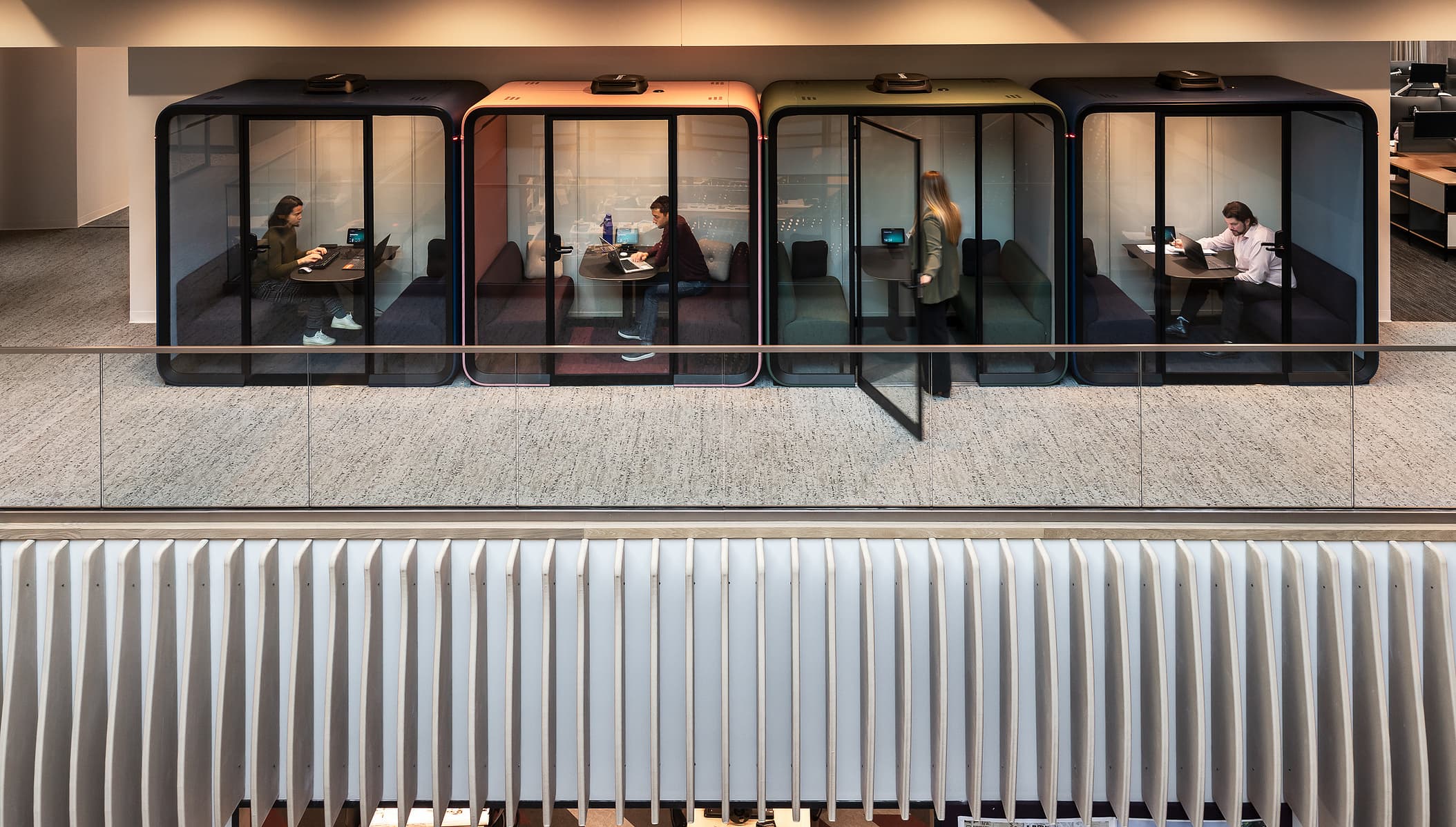 A set of 4 pods, manufactured by Finland based Framery.  Photgraphed within CLAYCO, St. Louis by Karen Palmer.